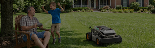 Child running on a freshly mowed lawn