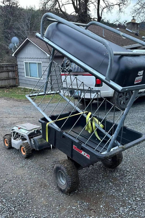Mowrator S1 towing a garden cart