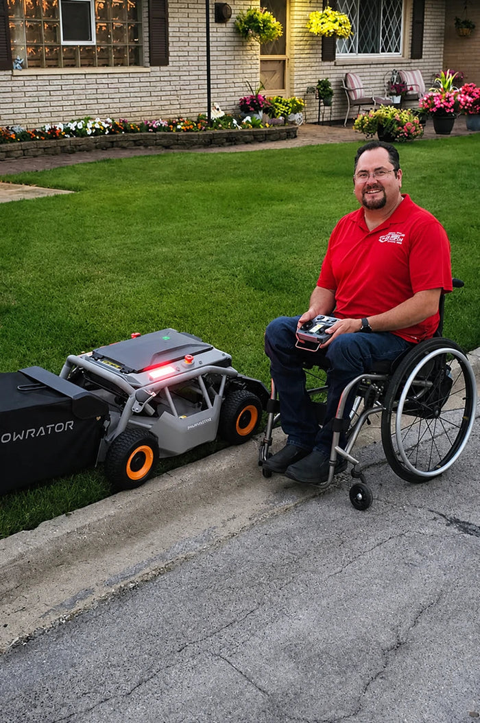 Man in a wheelchair mowing with the Mowrator remote