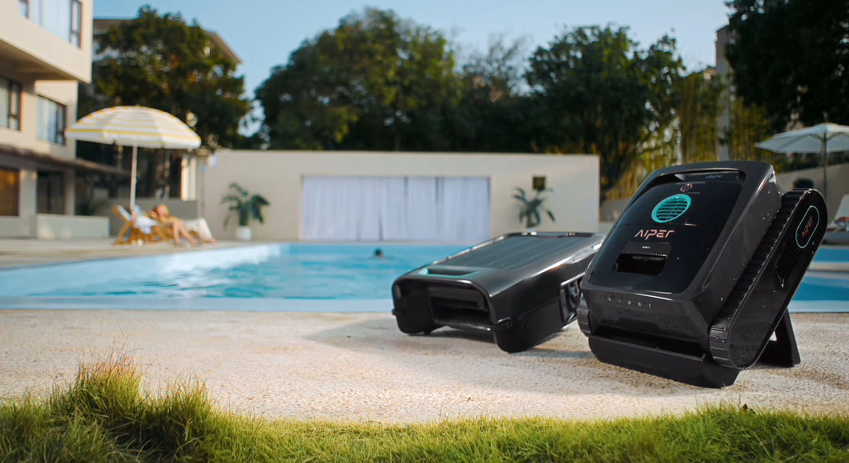 Aiper robotic pool cleaners on a sunny pool deck