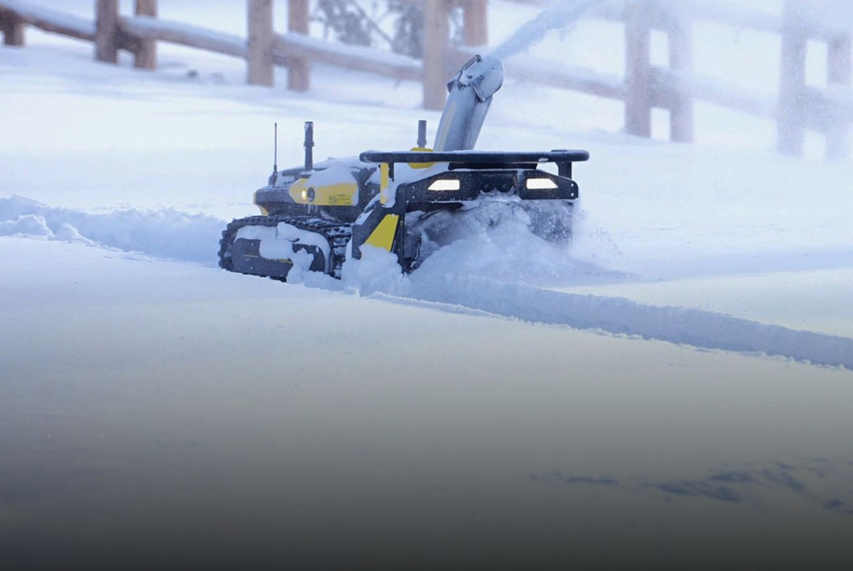 Yarbo Snow Blower module throwing snow off a path